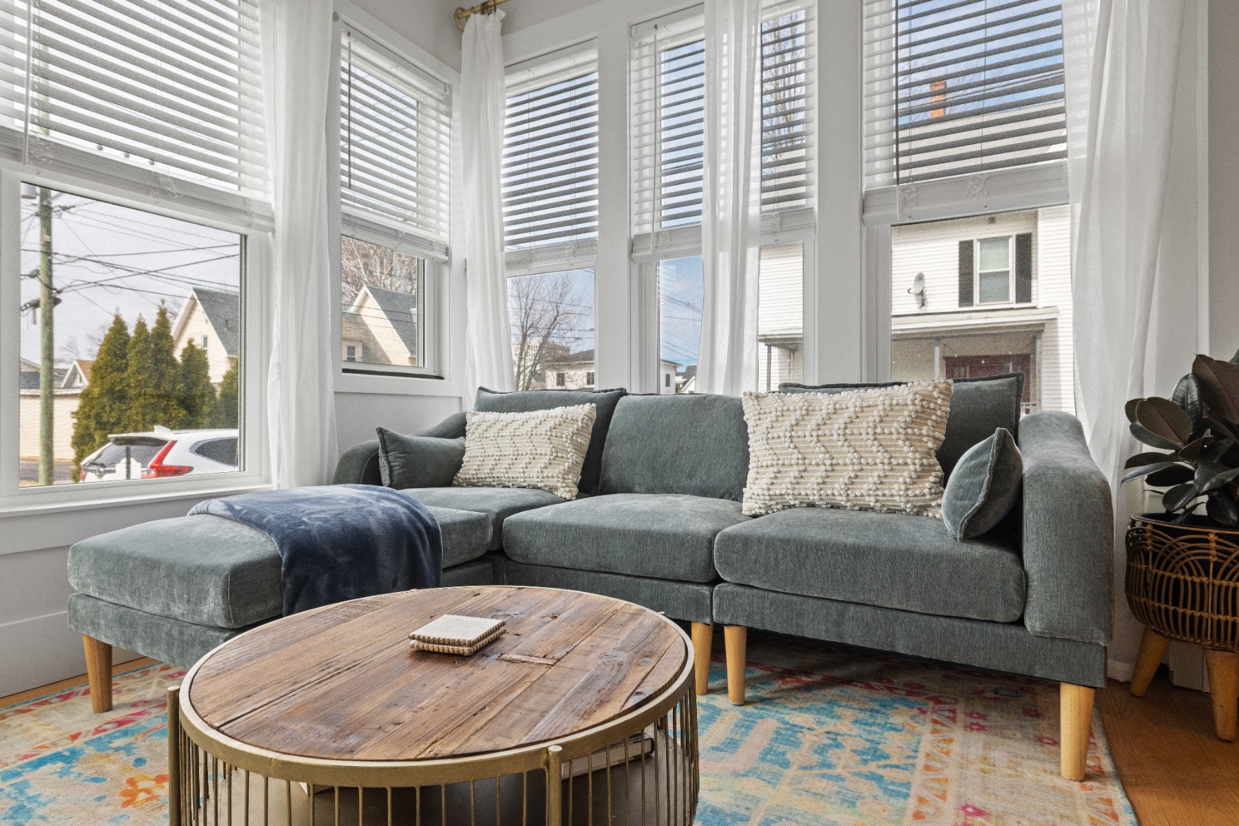 A grey L-shaped sectional in a lakeview home