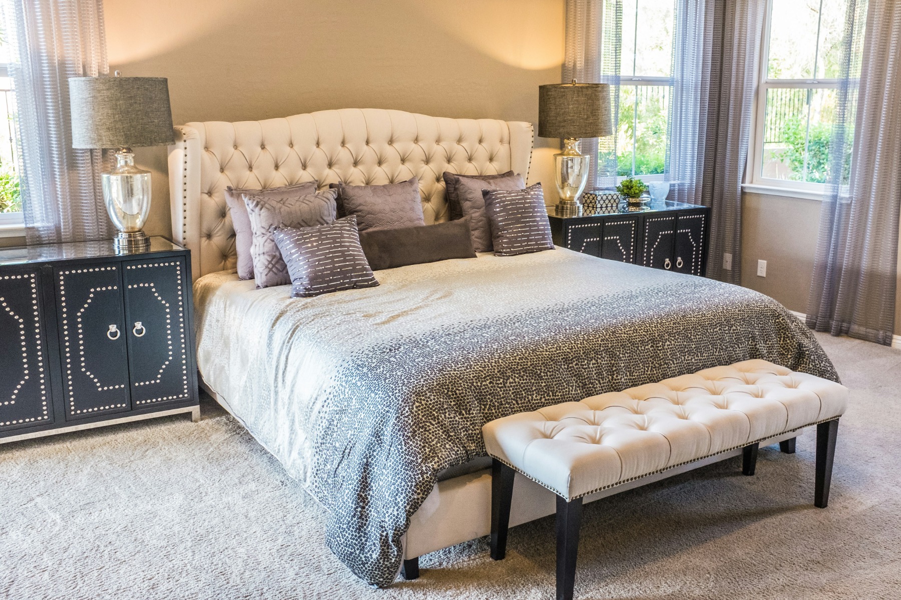 A luxurious bedroom set complete with a headboard and footboard bench