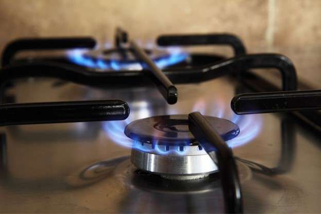 Two gas burners releasing blue flame