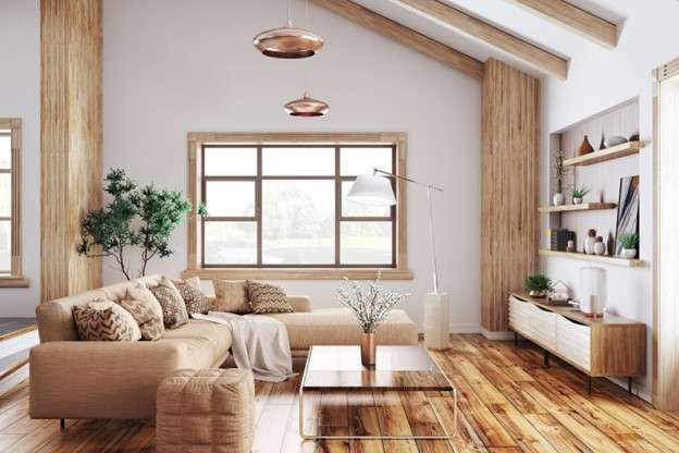 A living room with earthy colours, wooden furniture, and beams