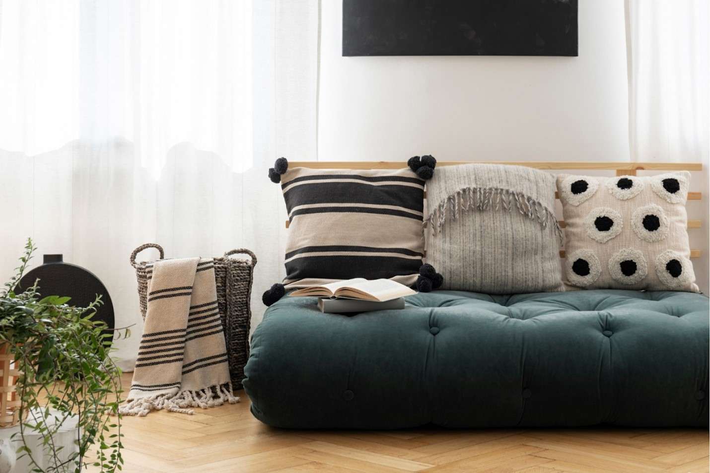 Low-profile sofa with three throw pillows