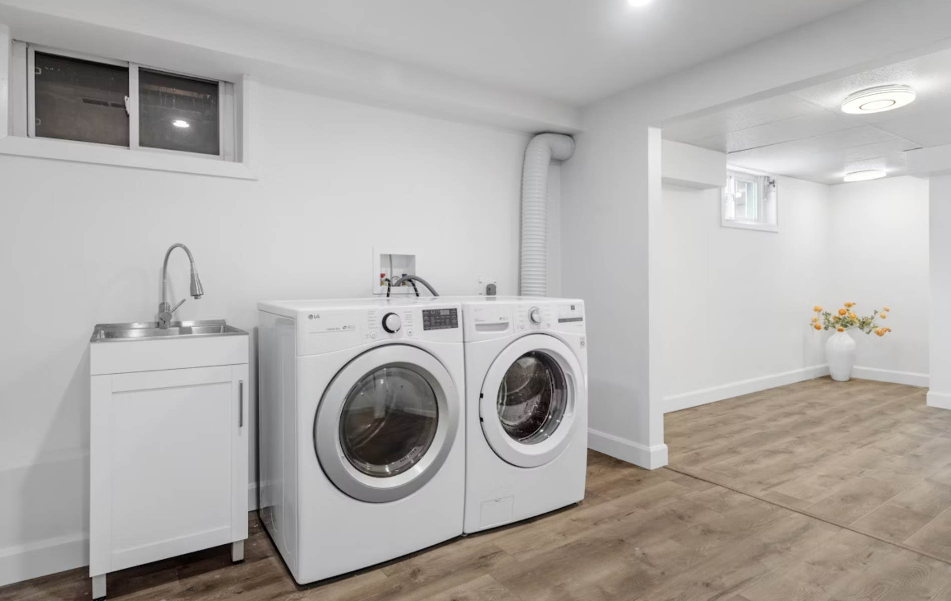 A washer and dryer in a finished basement