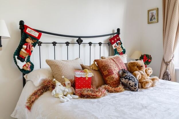 Guest bedroom with multifunctional bedroom furniture and Christmas decorations