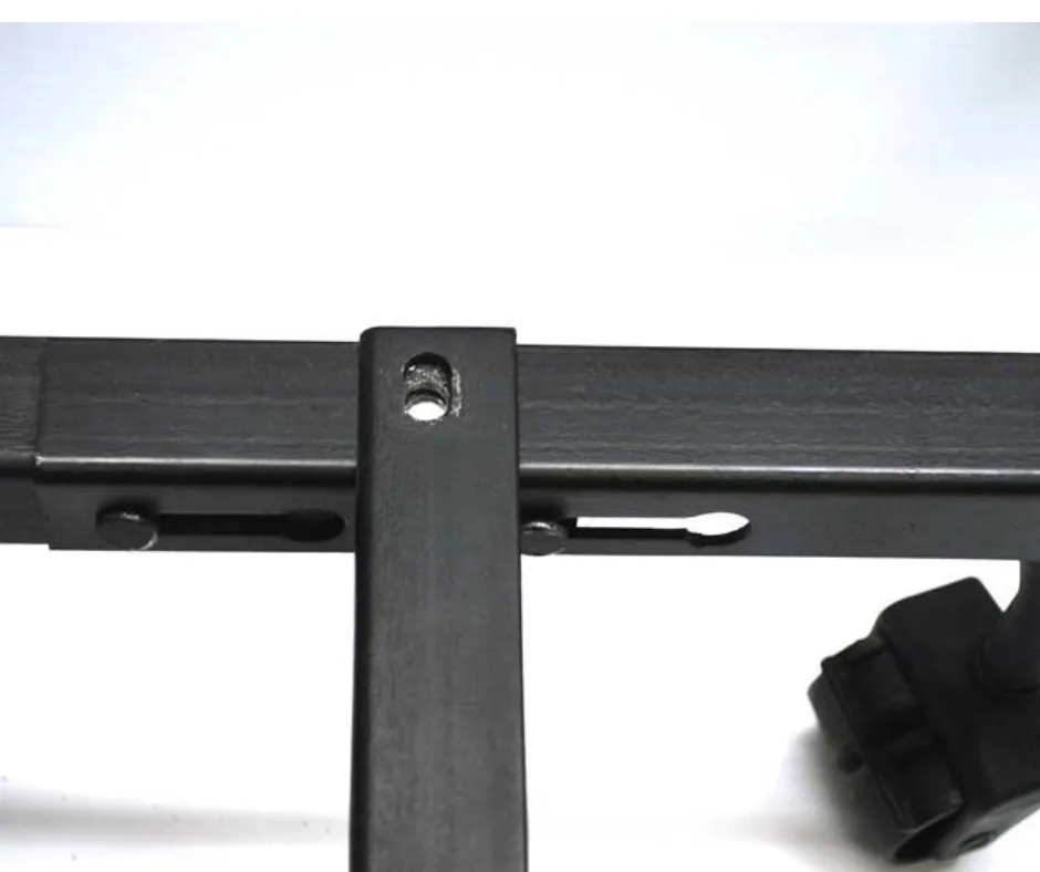 Line up the centre support bar parallel to the metal bed frame