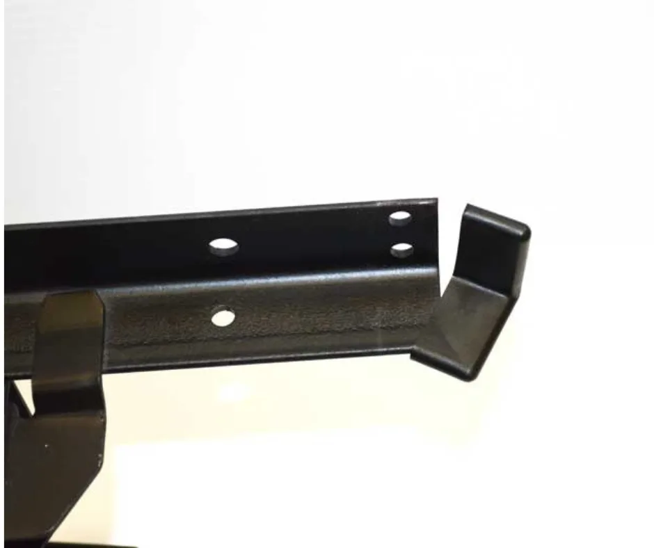 Adding angle protectors to a metal bed frame during assembly.
